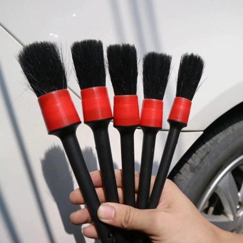 5-piece car detailing brush set for deep cleaning interior vents, wheels, and exterior emblems.