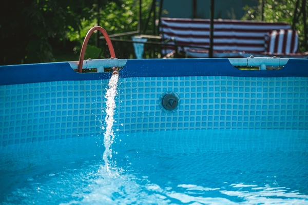 Clean swimming pool after filtration and water clarification treatment