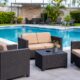 Durable pool furniture materials beside luxury swimming pool
