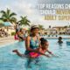 Parent supervising children at a swimming pool demonstrating supervised swimming safety practices